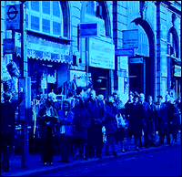 Folk queueing for a bus.