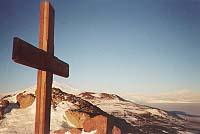 Scott's Cross against a mountain landscape