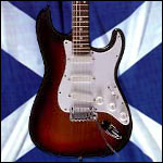 A guitar against the Scottish flag