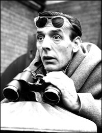 A man and a pair of binoculars