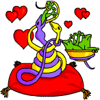 Two loved up snakes eating frogs