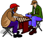 Two men, one black, one white, playing chess and wearing baseball caps