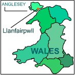 A map of Wales with an arrow pointing to Anglesey.