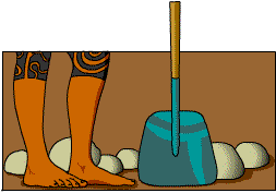 A pair of feet with Maori tattoos, a spade and some rocks